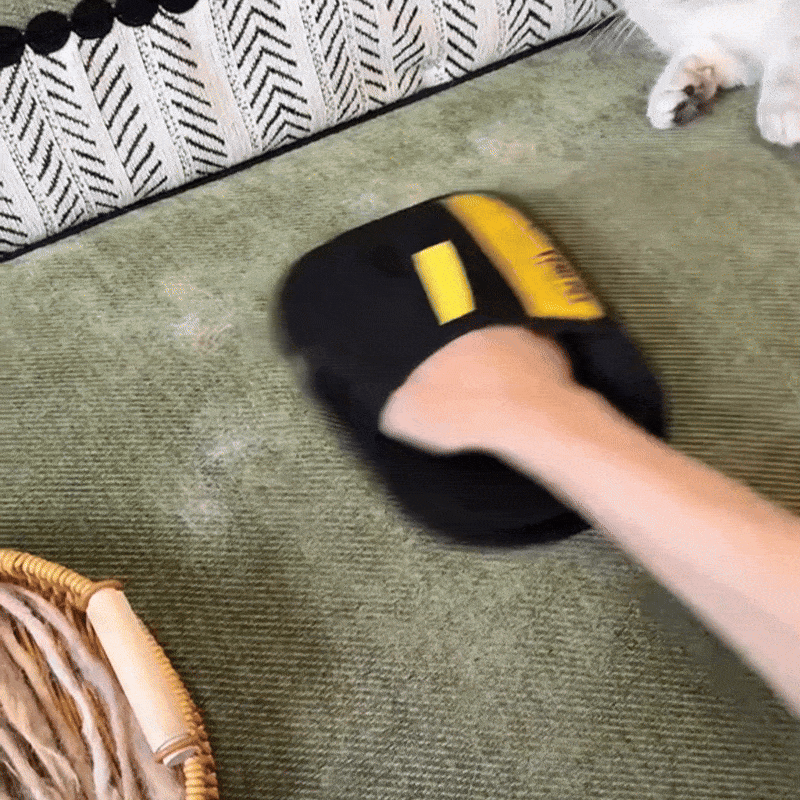 PawTidy™ glove removing fur from a pet bed – hygienic and reusable cleaning solution for pet accessories.